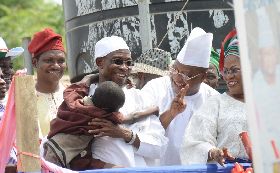 Aregbesola with a Toddler-1