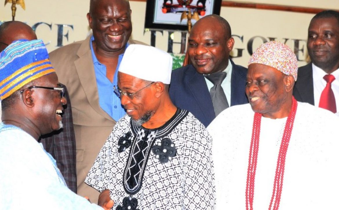 Governor-Aregbesola-exchanging-pleasantries-with-the-Chairman-of-LAUTECH-Governing-Board-Professor-Oluwole-Atoyebi-while-Aragberi-of-Iragberi-Oba-Folorunso-Agboade-Makanju-and-others-watch